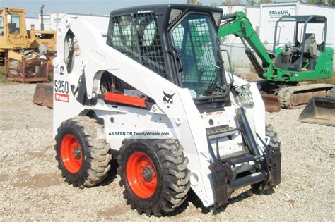 limestone boulder landscaping skid steer|Bobcat S250 Skid Steer Moving Large Rocks .